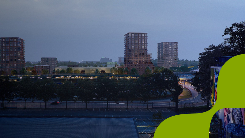 Gebouwen met planten en bomen op de voorgrond in de schemering